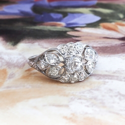 Edwardian Diamond Engagement Ring .63ct t.w. Circa 1920's Old European Cut Floral Filigree Platinum Engagement Ring